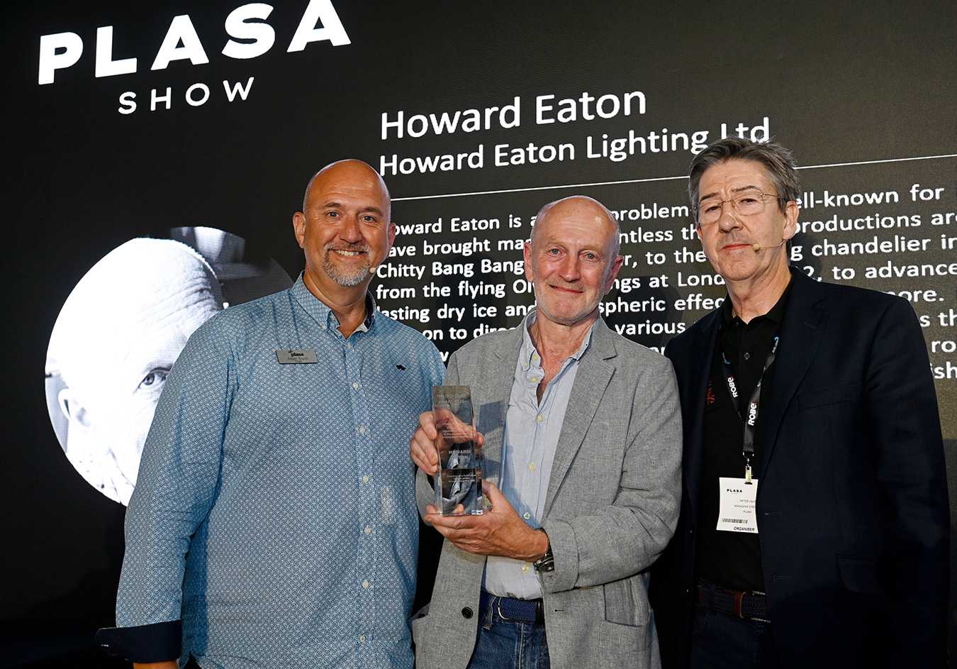Howard Eaton (centre) collects his Gottelier Award from PLASA's Adam Blaxill (left) and Peter Heath (right)