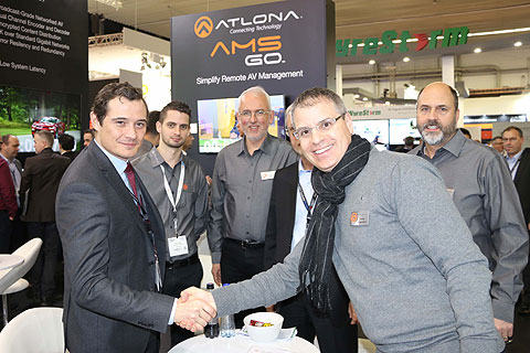 Sidev managing director Mathieu Payet and Atlona general manager Ronni Guggenheim shake hands at the official signing during ISE 2017 in Amsterdam