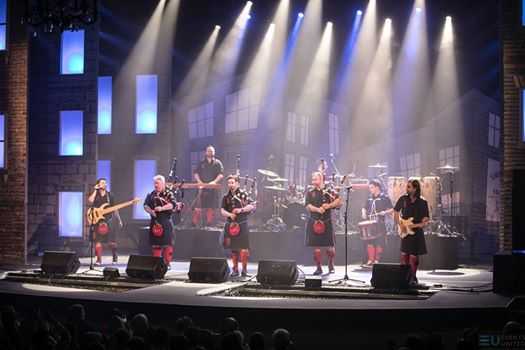 The band performs an upbeat fusion of bagpipe and rock music