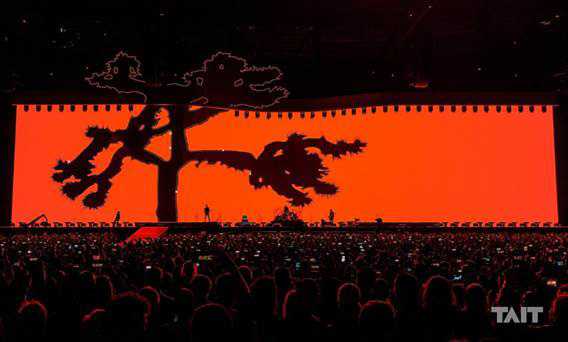 The enormous set mirrors the Joshua Tree silhouette with a custom scenic tree top header