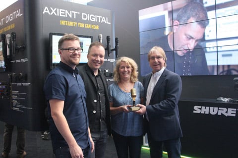 Stuart Moots and Tuomo Tolonen of Shure UK at the PLASA Show presenting Heather and John Penn of SSE with the Rental Partner of the Year Award 2017