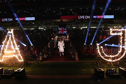 Anthony Joshua enters the arena