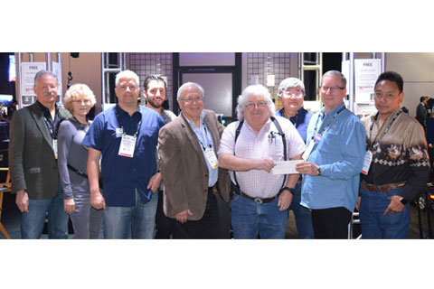 Lance Hughston, Sr. (fourth from right) and Rick Rudolph, BTS chair (second from right) with Hughston Engineering staff and members of the BTS Board of Directors