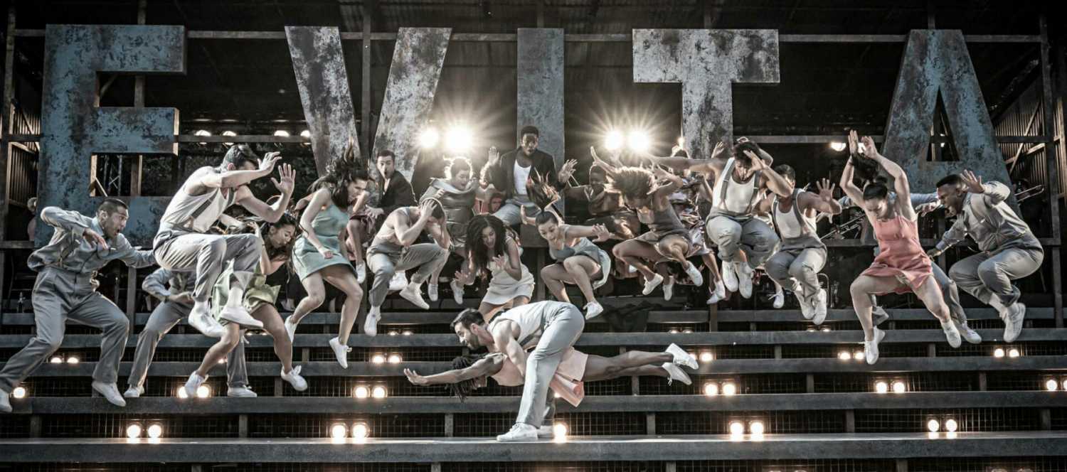 The production is staged on a dilapidated seating bleacher (photo: Marc Brenner)