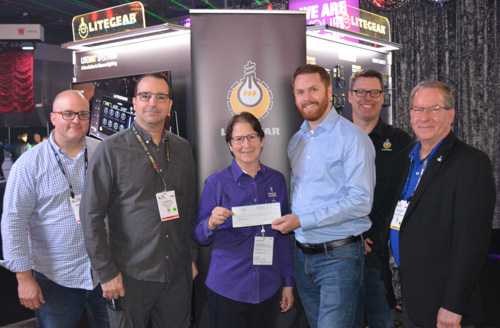 LiteGear’s Mike Bauman, Al DeMayo, Mike Wagner and Paul Royalty presenting the cheque to Lori Rubinstein and Rick Rudolph form Behind the Scenes