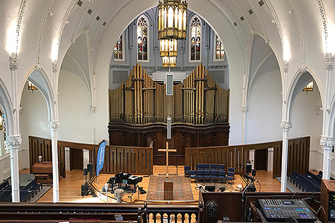 The ornate, high-ceiling sanctuary accommodates 550 people