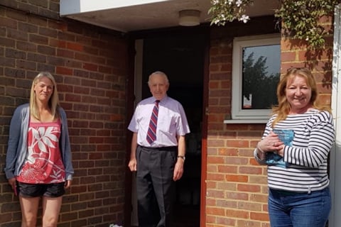 GIG’s global operations director, Bonnie May presents 97 year old WWII veteran with a hamper on VE Day 75