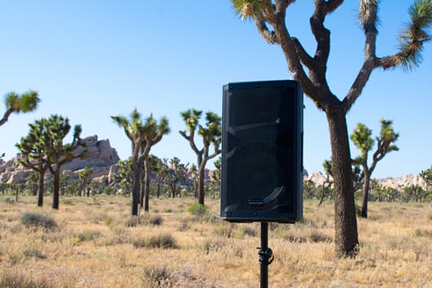 The speaker enclosure is fitted with a tough protective metal grille on its front