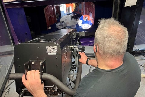 Technical manager Dave Wimpenny tests out the new 800w long-throw LED followspots (photo: The Lowry)