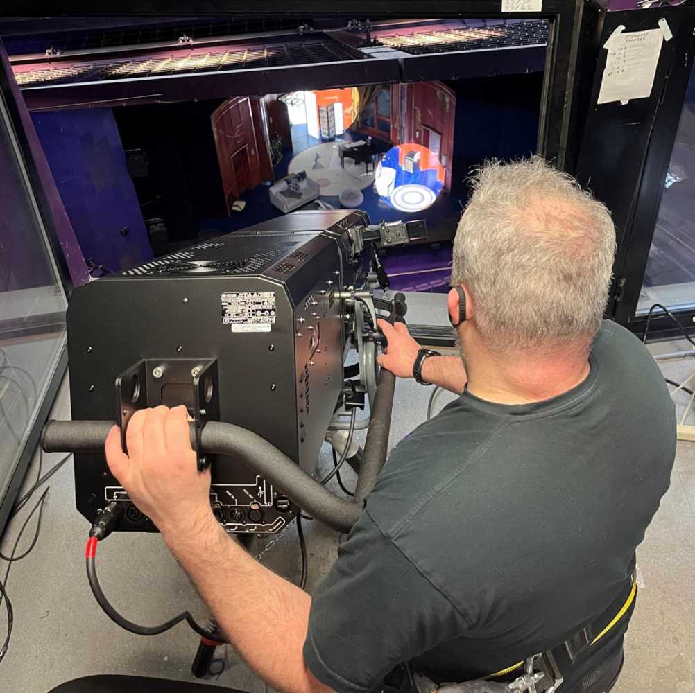 Technical manager Dave Wimpenny tests out the new 800w long-throw LED followspots (photo: The Lowry)