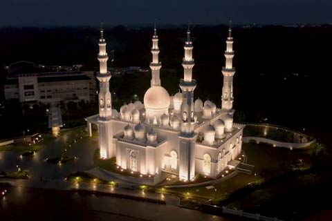 The pearlescent house of worship features 29 domes meant to signify family