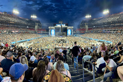 The tour is playing principally in NFL football stadiums, accommodating crowds of up to 65,000 per night